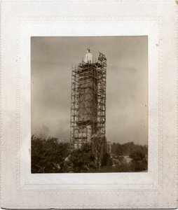 Construction of Compton Heights Water Tower Over Existing Standpipe, with Scaffolding Around Tower and Worker at Roof Level by Unknown